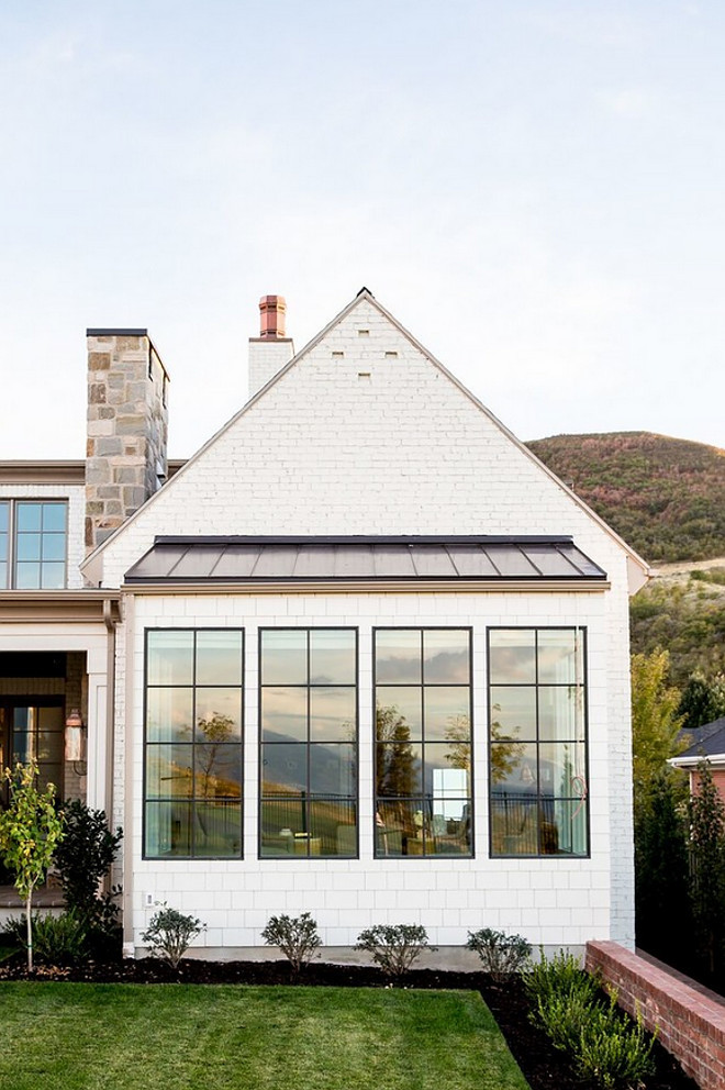 Painted Brick Home exterior and black steel windows. Modern farmhouse exterior. Modern farmhouse with painted brick and black steel windows. #Paintedbrick #exterior #blacksteelwindow #steelwindow Hyrum McKay Bates Design, Inc