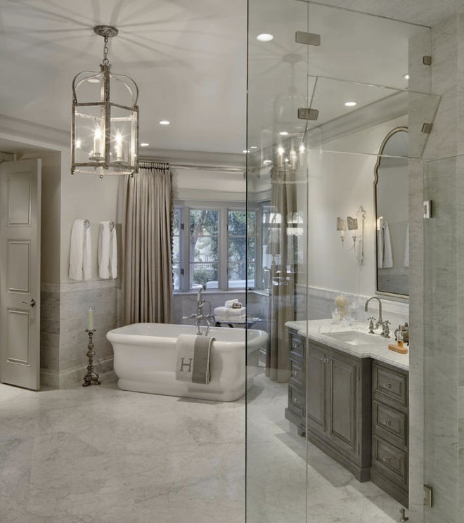 Pale grey bathroom. Pale grey bathroom with greywash cabinet. Pale grey bathroom with marble flooring and marble wall tile. Pale grey bathroom #Palegrey #bathroom Candelaria Design Associates