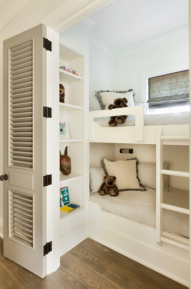 Small Bunk Room. Smartly designed small bunk room with bookcase for extra storage and louvered doors to add privacy. Small Bunk Room #SmallBunkRoom #BunkRoom Beth Webb Interiors