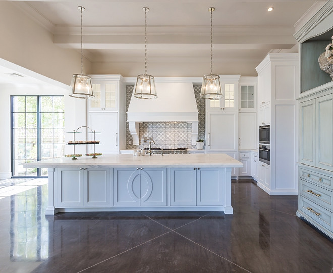 Transitional kitchen with white cabinets, cement backsplash tile and concrete flooring. Candelaria Design Associates