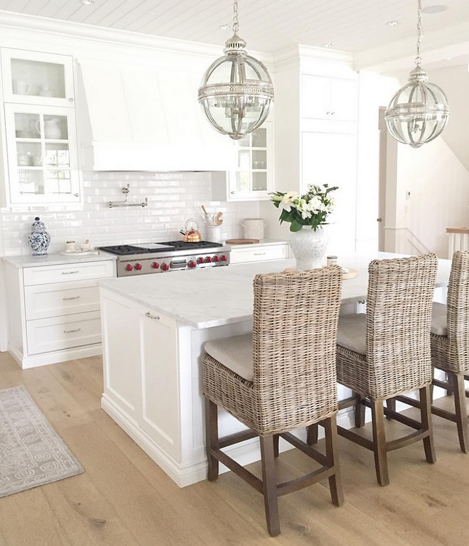 White kitchen painted in Benjamin Moore OC-117 Simply White and the Marble counter top is Bianco Carrara honed. jshomedesign