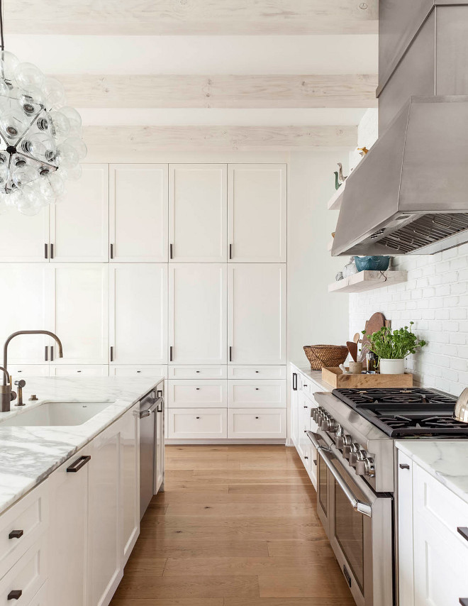 White kitchen with whitewashed ceiling beams. Crisp White kitchen with whitewashed ceiling beams. White kitchen with whitewashed ceiling beams #Whitekitchen #whitewashedbeams #ceilingbeams #whitewashedceilingbeams Robert Elliott Custom Homes