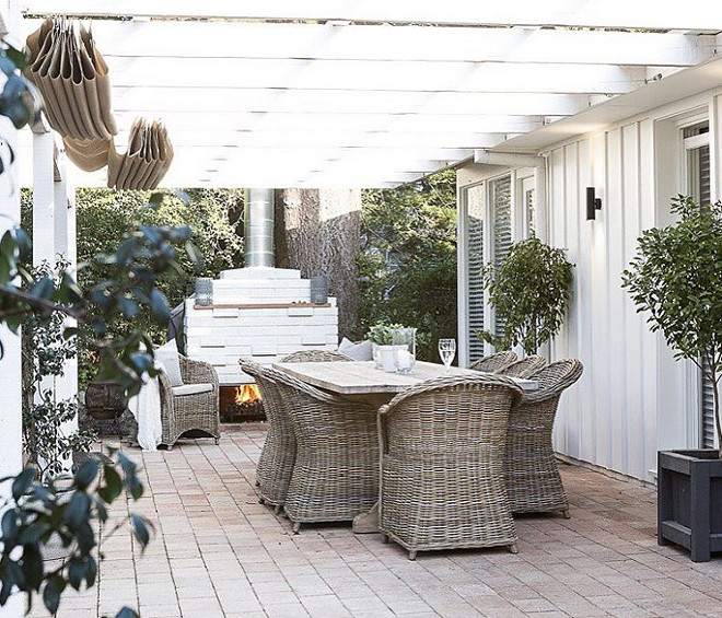 Pergola. White pergola. Wicker furniture constrasts againts the Pergola. #Pergola #whitepergola Cottonwood Interiors