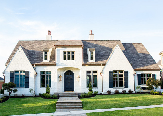 downspouts to complete the French Farmhouse Transitional style. The brick is painted KWAL paint: 'Skoki'. #PaintedBrickExterior #PaintedBrick #Exterior Hyrum McKay Bates Design, Inc.