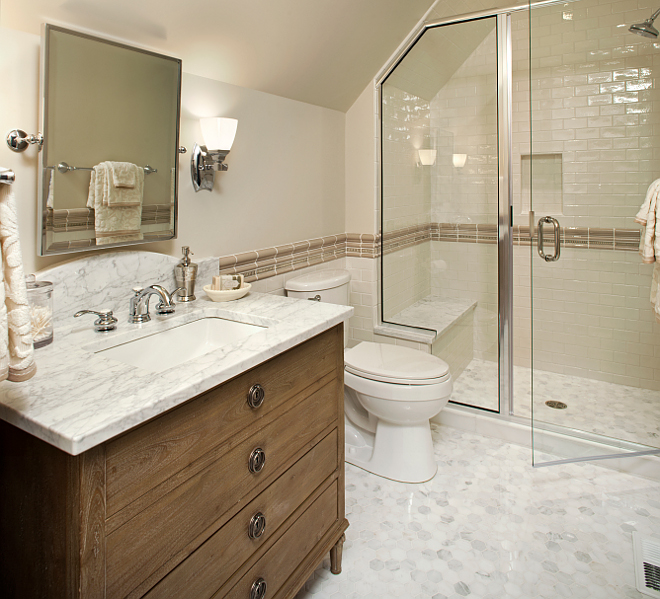 Bathroom Piant color and flooring. Paint color is Benjamin Moore Baby Fawn OC-15. The ceiling color is 50% white/50% Linen White 912. The floor is a statuary white marble 2x2" hexagon tile. The wall is a 2.5x5" white glazed ceramic tile and the chair rail tile is an ecru raised deco tile and pencil liner. 50-linen-white-912 Vivid Interior Design. Hendel Homes