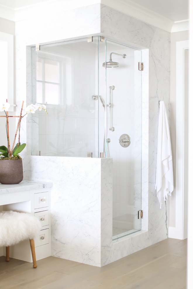 Bathroom Marble Shower Surround. Marble shower frame is Statuarietto marble. #marble #showerframe #Statuarietto Winkle Custom Homes. Melissa Morgan Design. Ryan Garvin Photography