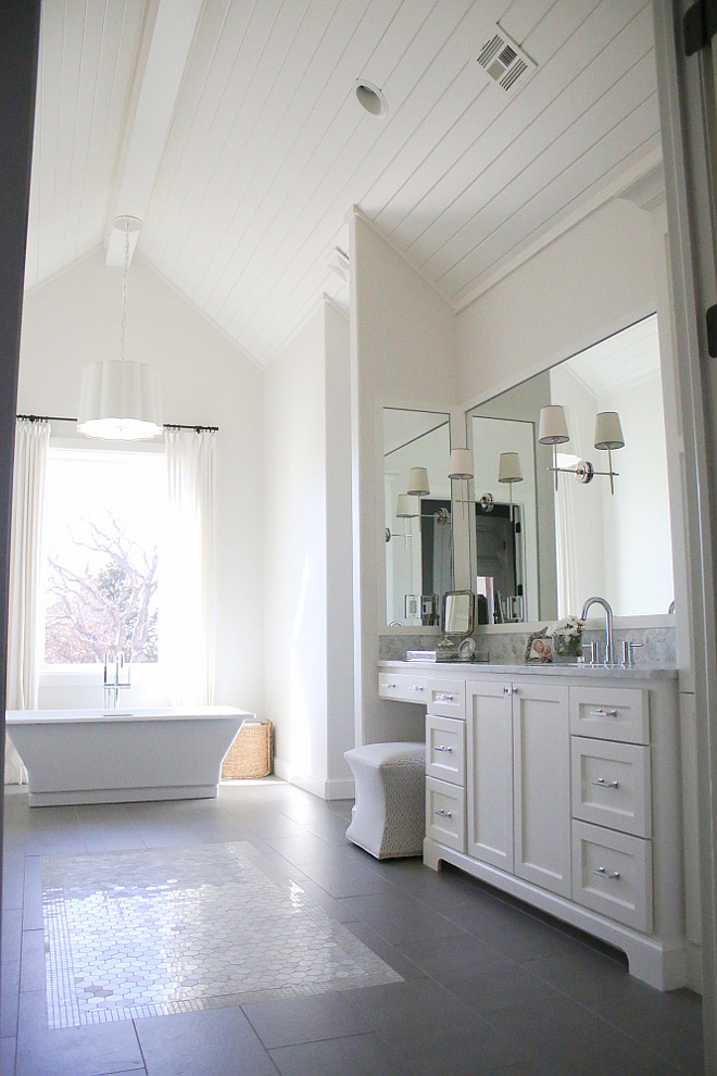 If I had to choose a favorite room in our home, this is probably it. I was so into the shiplap look and it was starting to become more and more popular. We decided to put it on the ceilings and vault the ceiling for a show stopping statement when you walk into the room. The freestanding tub is like art and the pendant above it is truly beautiful in person. All white makes it so light and airy. The tile rug was a in touch made from marble hexagon tiles and a marble mosaic border #bathroom #ceiling #shiplap bathroom-ceiling Home Bunch's Beautiful Homes of Instagram curlsandcashmere