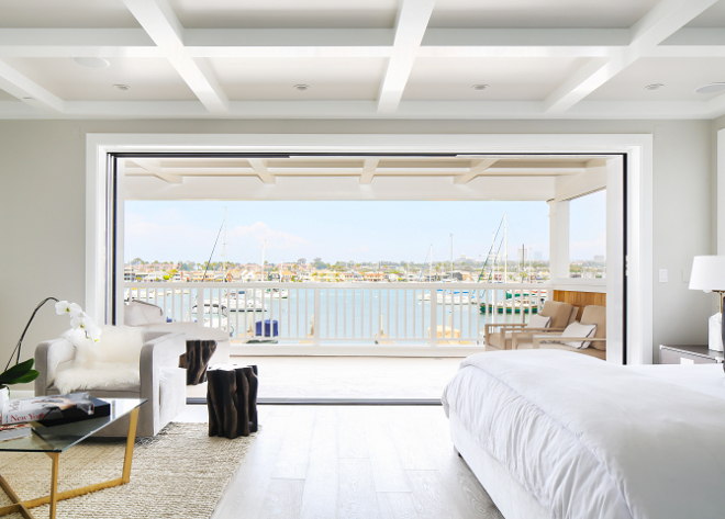 Bedroom Retractable sliding doors. Bedroom Retractable sliding doors open to a large covered balcony with sweeping views of the bay. Retractable sliding doors. #Bedroom #Retractableslidingdoors Winkle Custom Homes. Melissa Morgan Design. Ryan Garvin Photography