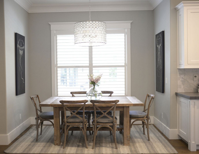 Kitchen nook. This cozy nook is perfect for family moments. The farmhouse table is Restoration Hardware Salvaged Wood Farmhouse in Natural. Chairs are RH Madeline Chairs in Weathered Oak. Rug is Dash and Albert and art is by Z Gallerie. #kitchennook #nook #breakstfastnook breakfast-nook Eye for the Pretty