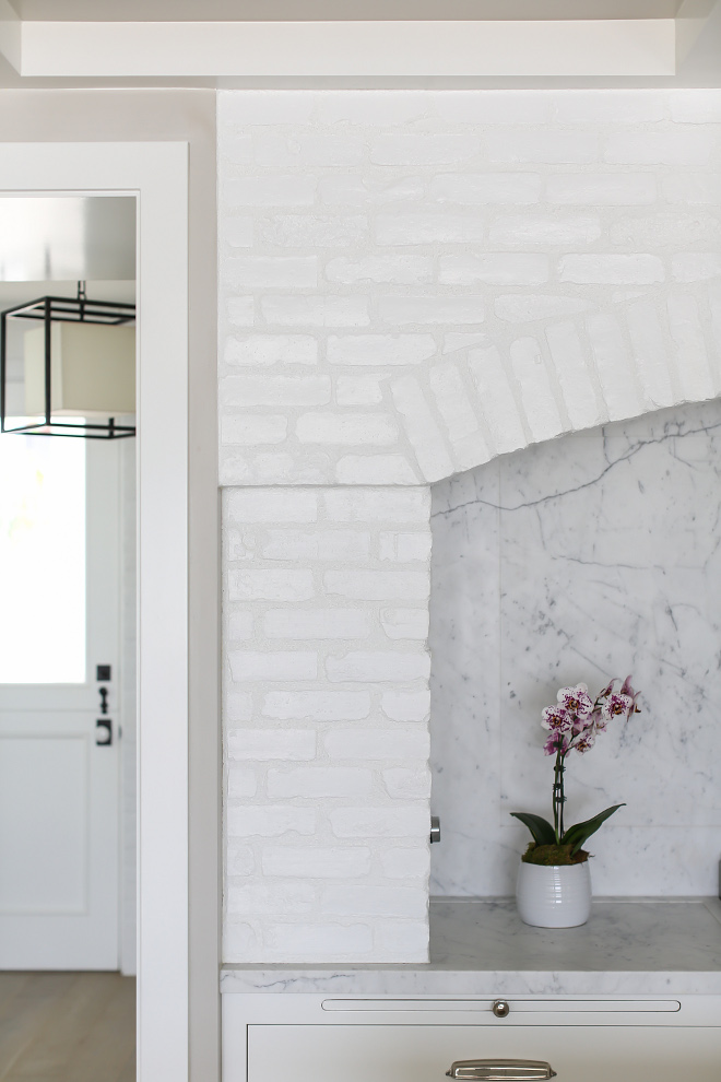 Brick Kitchen Hood. White Brick Stove Accent: Reclaimed white painted brick framing an integrated hood vent. This design is fresh and timeless! #kitchen #brick #hood #whitebrick #kitchenbrick #paintedbrick #brickbacksplash #paintedwhitebrick #kicthenwhitebrick #whitewashedbrick #reclaimedbrick Winkle Custom Homes. Melissa Morgan Design. Ryan Garvin Photography