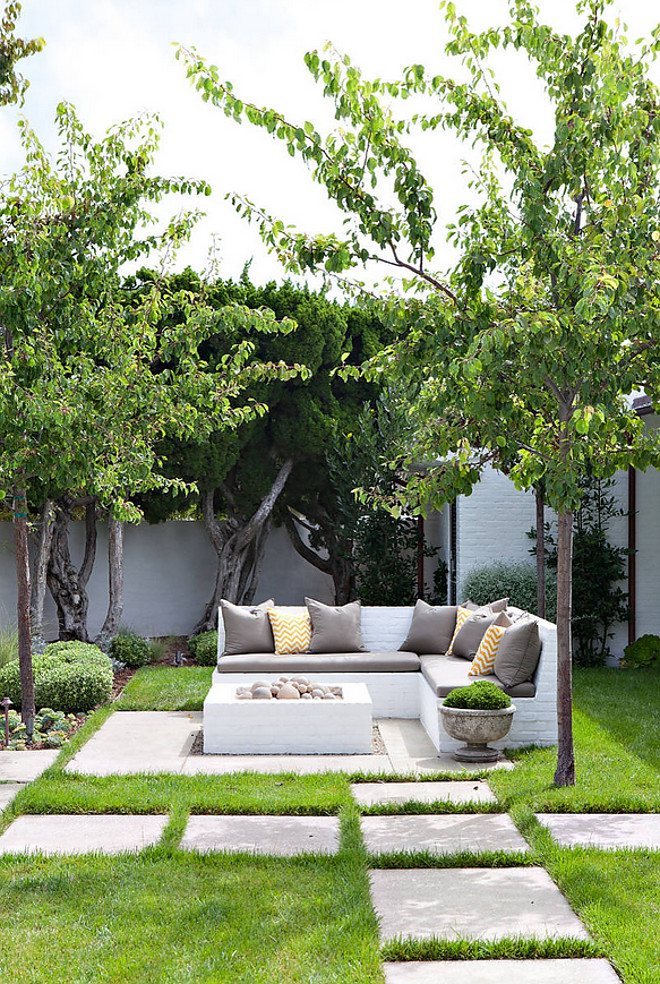 Brick Outdoor Sofa and Fireplace. The brick bench is a custom "L" shape bench. The bench is 8'-6" x 8'-6" with a seat depth of 30". The square fire feature is 4' x 4'. Molly Wood Garden Design