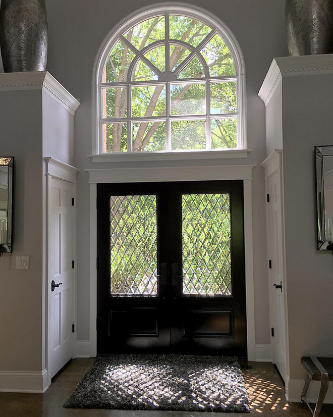 Dark stained front door. The homeowner have replaced the old front door and side lights, with brand new custom mahogany double doors with diamond beveled glass. have replaced the old front door and side lights, with brand new custom mahogany double doors with diamond beveled glass. 