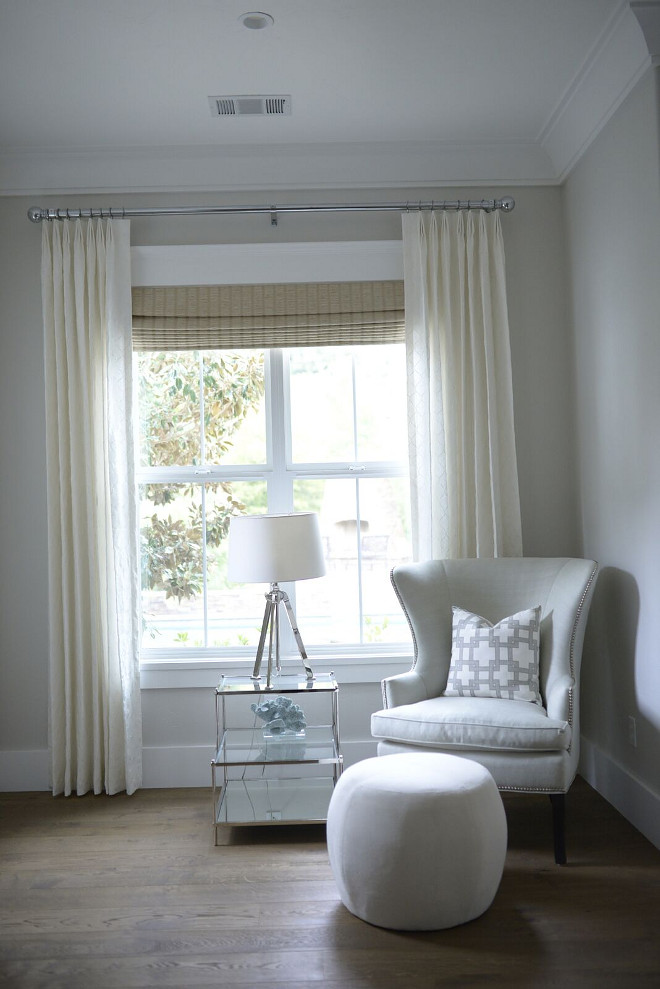 Bedroom Chair: Williams Sonoma Home Chelsea Wing Chair in Linen Cottonweave color is Mist. Pillow is Kravet City Squares. Drapery: Motorized woven wood window coverings are custom from a company called Best Line (color is Spruce/Almond). Eye for the Pretty