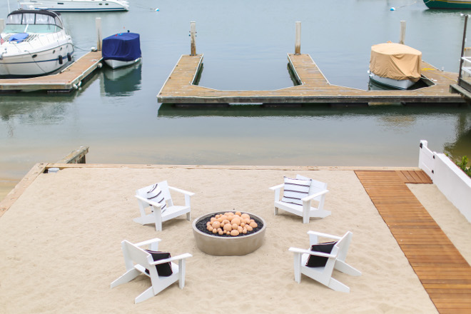 Firepit and white chairs with blue and white pillows. Winkle Custom Homes. Melissa Morgan Design. Ryan Garvin Photography