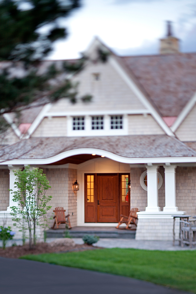 Siding is cedar shake. Wood door and cedar shake siding. #cedarshakesiding #wooddoor #homeexterior Vivid Interior Design. Hendel Homes