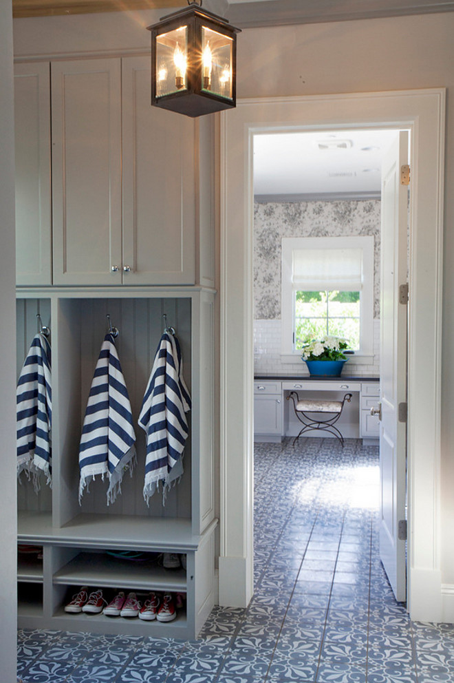Grey mudroom with patterned floor tile opens to laundry room. #Greymudroom #patternedfloortile #laundryroom gray-mudroom-opens-to-laundry-room-with-patterned-floor-tiles Nicole Lee Interior Designs