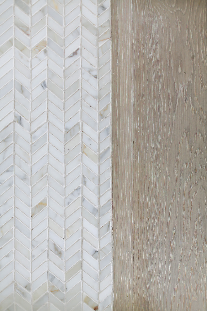 Herringbone floor tile and white oak floor. Light wire brush white oak hardwood floor with marble herringbone tile. Winkle Custom Homes. Melissa Morgan Design. Ryan Garvin Photography