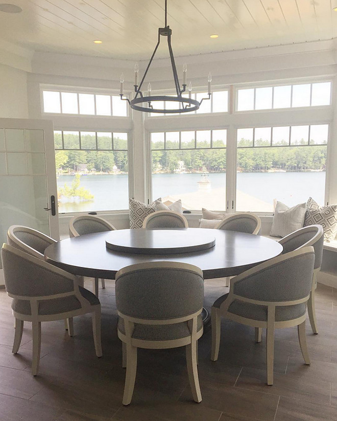 Kitchen nook. Kitchen nook with custom round table and chairs with a window seat under bay windows with transoms and tongue and groove ceiling. #Kitchennook Brooke Wagner Design
