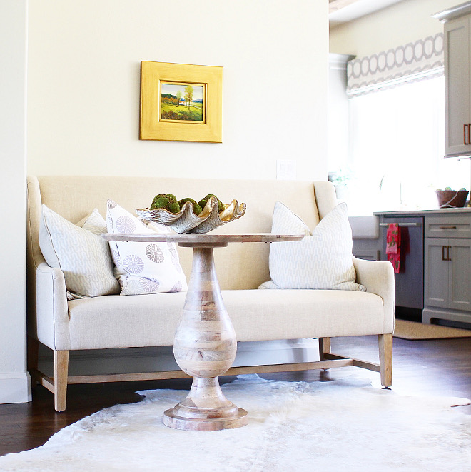 A settee is located by the wall that divides the great room from the kitchen. Isn't this cozy spot perfect for reading? Home Bunch's Beautiful Homes of Instagram curlsandcashmere