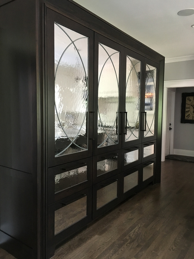 Kitchen with antique mirrors on the refrigerator and pantry cabinet. This kitchen armoire has 2 refrigerators in the center with 2 freezer drawers below each refrigerator. On either side of the refrigerators are pantry cabinets with pullout drawers and pantry drawers below. I chose hardware for the armoire to be sleek and oil rubbed bronze to blend in with the wood, so that it wouldn’t be busy with the mirrors. Beautiful Homes of Instagram Sumhouse_Sumwear