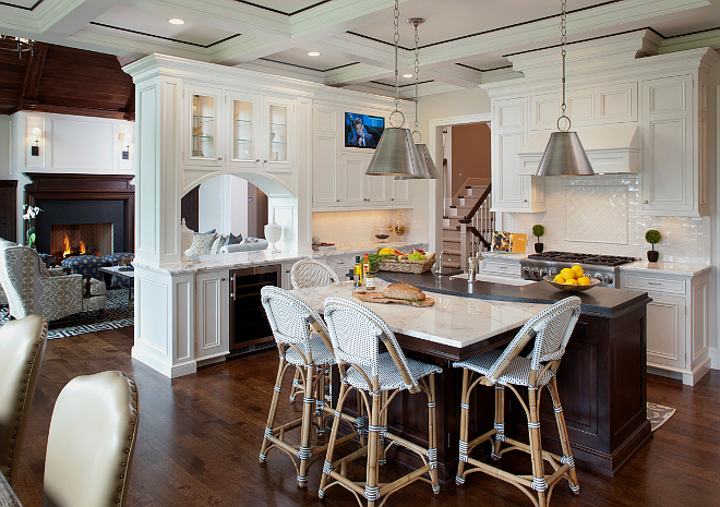 Kitchen. The kitchen is one of my favorite rooms of the house. The layout is perfect for cooking and family living. Notice the island with its own bistro-style table area. Ceiling is painted in Benjamin Moore Icicle 2142-70 and features Poplar wood trim in custom stain. The kitchen island is Walnut in custom stain. #kitchen #kitchens #kitchen #kitchens Vivid Interior Design. Hendel Homes