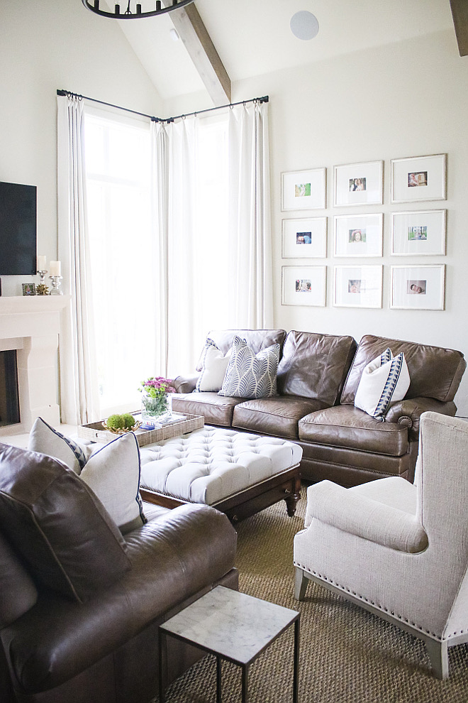 Living room leather sofas. "Our leathers sofas anchor the room and are very kid friendly of course. We had those at our last home and decided we would incorporate them into our new home and make everything else light and bright". Leather Sofas: Norwalk Furniture. Pillows: Ryan Studio. Seagrass Rug: The Perfect Rug Co. Marble Side Tables: Ballard Designs. Draperies: Custom white linen draperies. Chair: Sam Moore for Hooker Furniture. #livingroom #leather #sofa living-room-leather-sofas Home Bunch's Beautiful Homes of Instagram curlsandcashmere