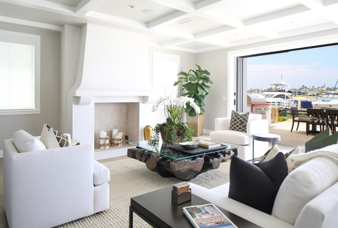 Living room Furniture. Sofa and lounge chairs were custom made by Melissa Morgan Design. The sofa and the chairs feature Belgian linen fabric with down wrapped foam seats and down back. Stained legs of furnishing were to match the dining table. Winkle Custom Homes. Melissa Morgan Design. Ryan Garvin Photography 