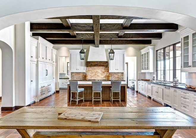 Mediterranean Kitchen. The accent brick backsplash is are called Chicago Bricks. The Kitchen is 20'6" x 25' 6". The space behind the kitchen is a formal pantry with a desk. It measures 8' x 26' 6". Kitchen hood features reclaimed barn wood. #Mediterranean Kitchen. The accent brick backsplash is are called Chicago Bricks. The Kitchen is 20'6" x 25' 6". The space behind the kitchen is a formal pantry with a desk. It measures 8' x 26' 6". Kitchen hood features reclaimed barn wood mediterranean-kitchen-accent-brick-backsplash The Refined Group