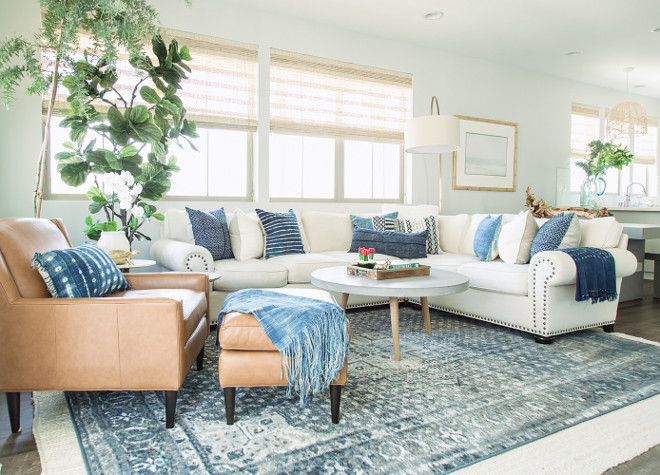 Living room Design: "We worked hard to make this space light and fresh. We love all the natural light and complimented it with different shades of grey and blue. The cool colors paired with the cream linen couch look great and we love how the different textures and patterns on the pillows work together. It was so much fun bringing in the concrete accents and we think this modern twist really adds to the room's uniqueness". modern-living-room-color-palette-small-living-room-with-modern-color-palette-modern-living-room-color-palette-modernlivingroom-livingroomcolorpalette-livingroom-colorpalette