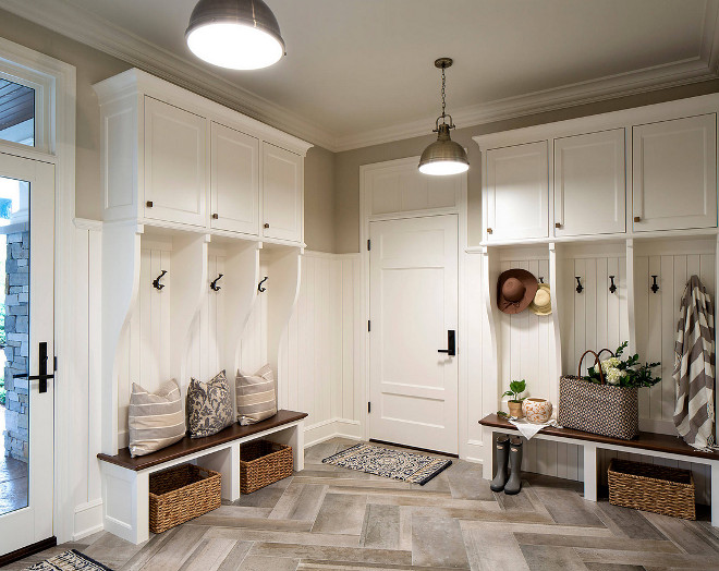 Mudroom. Mudroom Cubbies, mudroom lighting, mudroom Large Herringbone Floor Tile. #mudroom #cubbies #lighting #LargeHerringboneFloorTile mudroom-mudroom-cubbies-mudroom-lighting-mudroom-large-herringbone-tile Hendel Homes. Vivid Interior Design - Danielle Loven.