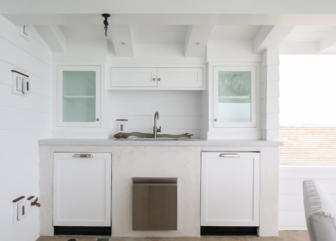 Outdoor kitchen shiplap. The outdoor wet bar features two Miele dishwashers and an ice maker. Winkle Custom Homes. Melissa Morgan Design. Ryan Garvin Photography