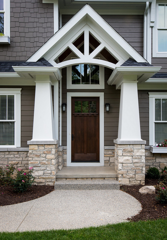 Tapered Craftsman Column. Porch with Tapered Craftsman Column. Portico features tapered craftsman columns. Stone is Fond Du Lac Rustic by Halquist with 4" limestone brick ledges. Front door is a Simpson door, wood, stained onsite. Craftsmen Style porch columns. Tapered Craftsman Column. Porch with Tapered Craftsman Column and stone #TaperedCraftsmanColumn #Porch #Tapered #CraftsmanColumn porch-column #stone Lindsey Markel