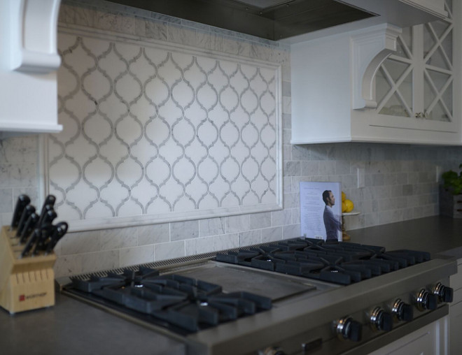 Rangle Backsplash. Backsplash. Range mosaic is 24"x44" Custom Toledo Pattern Carrara and Thassos Marble. Remaining backsplash is 3"x6" honed Carrara subway tile #Backsplash #kitchenbacksplash range-backsplash #rangebacksplash Eye for the Pretty