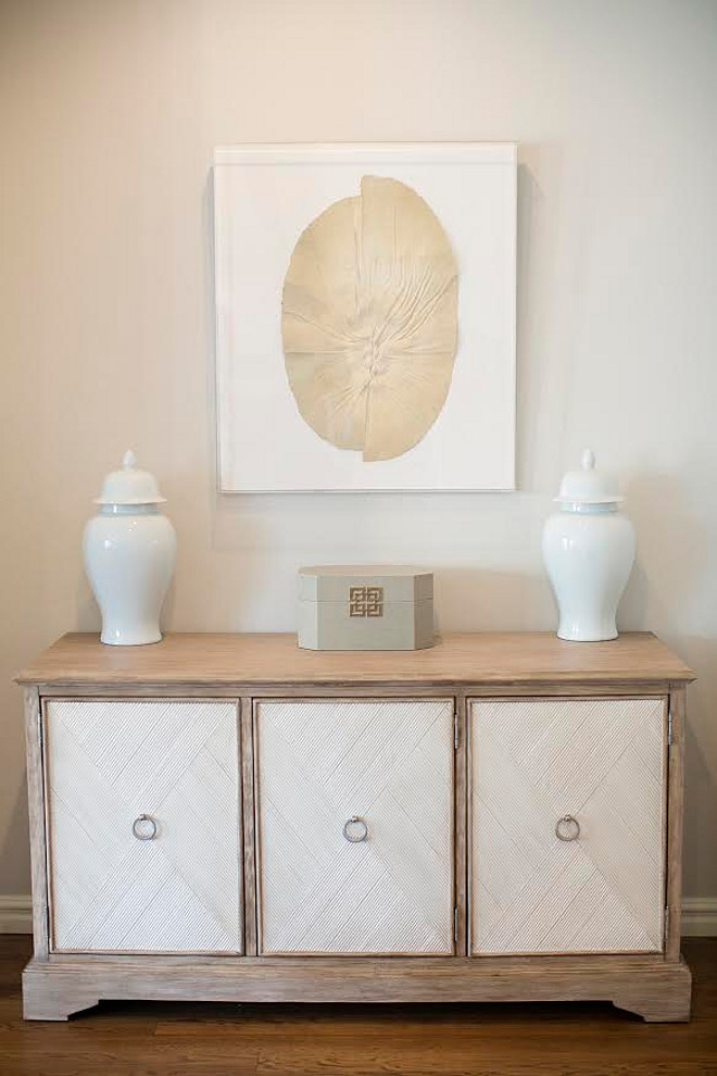 Sideboard. The right side of the room features a sideboard from Gabby Home, that can be purchased through Ivy House. The art above was found at an estate sale and is the same art featured in the Master Bath. The ginger jars boxes and other accessories can also be purchased through Ivy House. Wall paint color is BM Stonington Gray. #Sideboard sideboard Ivy House Interiors