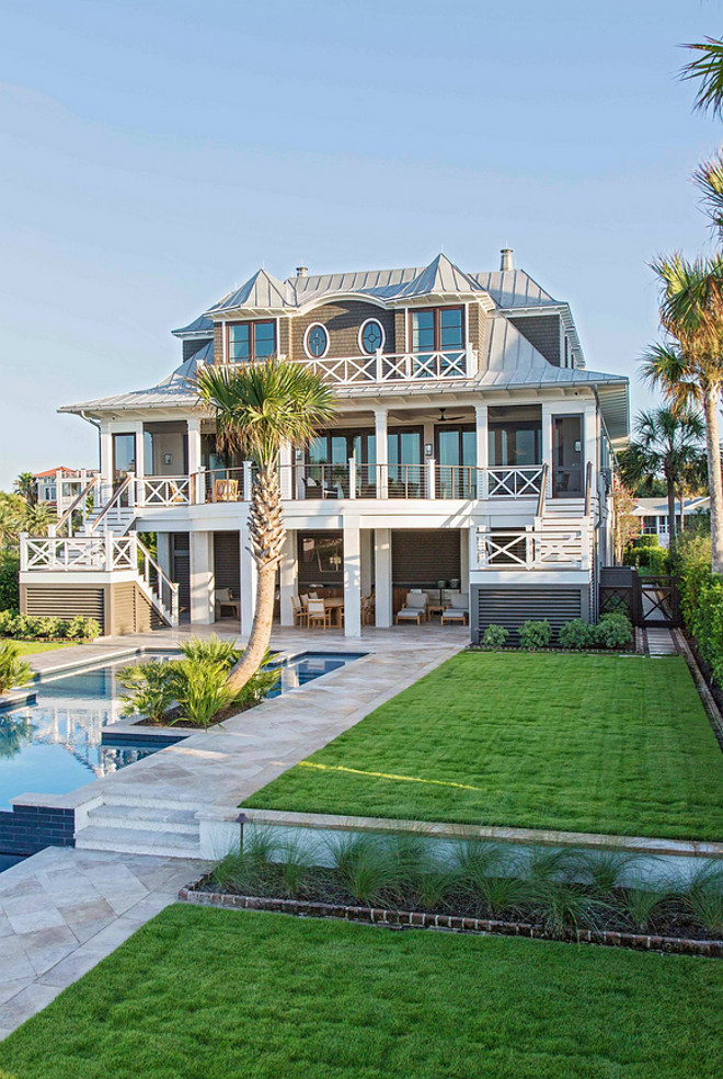 Beach house exterior. The exterior of this home combines dark stained cedar shakes with metal roof. #Beachhouse #homeexteriro #cedarshakes #metalroof Herlong & Associates Architects + Interiors