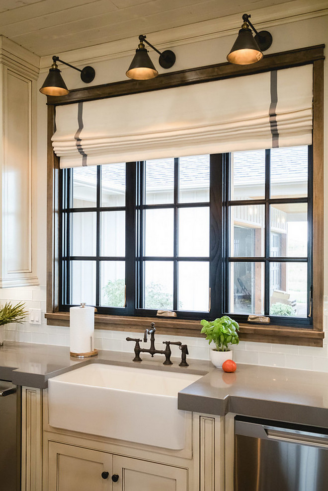 Black Kitchen Window. Kitchen features a black window above sink and three wall sconces. #kitchen #blackwindow #kitchenwindow #blackkitchenwindow Alicia Zupanblack-kitchen-window