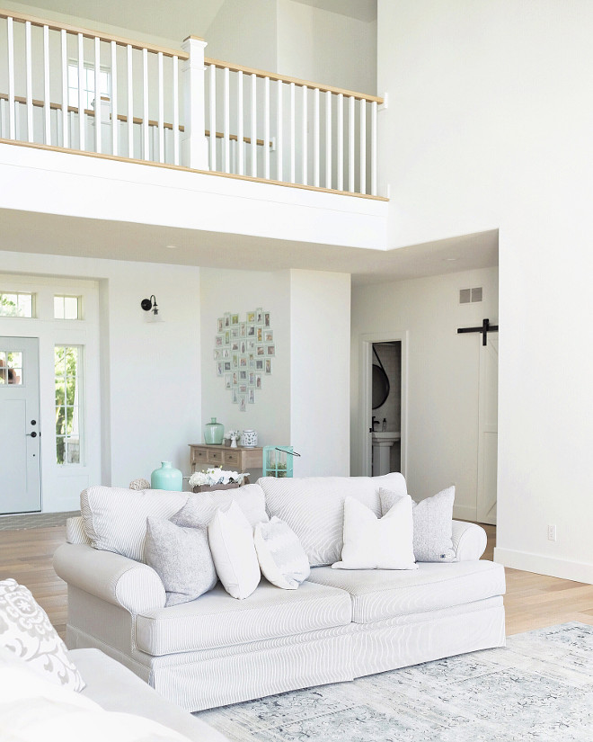 Farmhouse living room. White Farmhouse living room with catwalk. Farmhouse living room. Farmhouse living room ideas #Farmhouse #livingroom #Farmhouselivingroom #Farmhouseinteriors Beautiful Homes of Instagram @nc_homedesign via Home Bunch