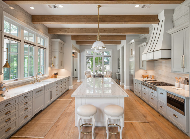 Grey kitchen. Grey kitchen with white hood. This grey kitchen features a custom built hood with powder coated finish. #greykitchen #whitehood #kitchenhood #kitchen #kitchens Allan Edwards Builder Inc