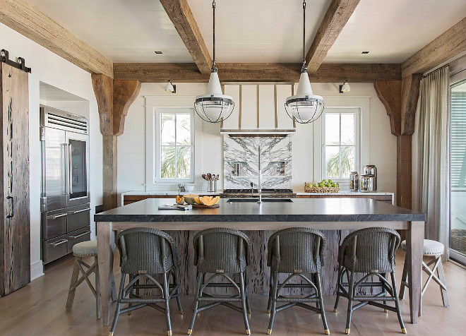 Chic Rustic Kitchen. This kitchen is really full of impressive details! Reclaimed beams add warmth to the generous size while shiplap walls and ceilings, painted in an off-white color, bring some light to the entire space. Chic Rustic Kitchen with rustic beams and shiplap ceiling and walls. Chic Rustic Kitchen #ChicRusticKitchen #RusticKitchen #kitchen Herlong & Associates Architects + Interiors
