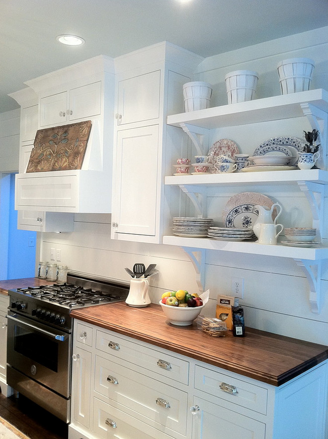 Small Farmhouse Kitchen. Small Farmhouse Kitchen. Small Farmhouse Kitchen with white cabinets, wide plank backsplash and open selves. Countertop is solid walnut countertop. No stain at all. Clear coated. #Farmhousekitchen #smallfarmhouse #kitchen #farmhouse #smallkitchens #plankbacksplash #wideplank #wideplankbacksplash Renew Properties