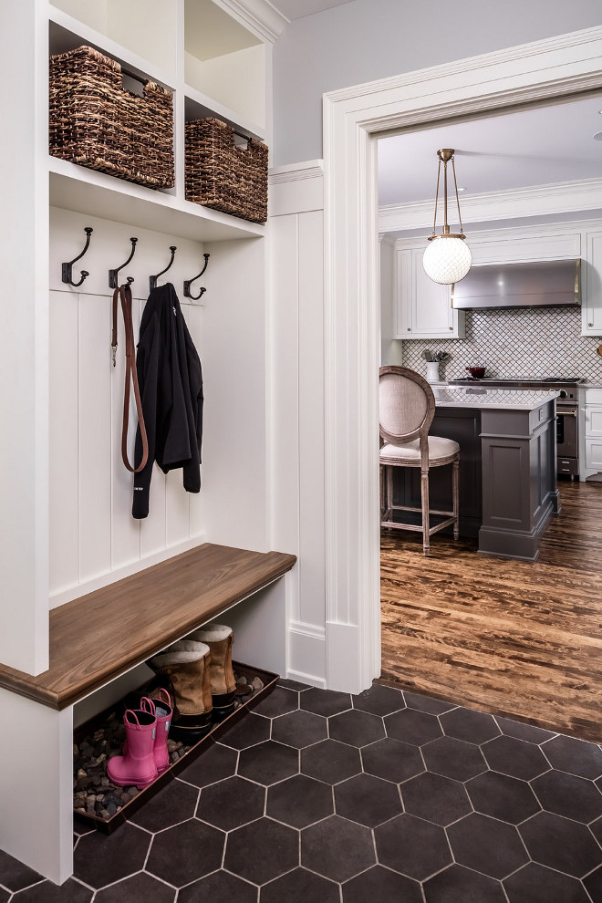 Mudroom. Small Mudroom. Small mudroom dimensions and flooring. The mudroom bench top is 1 1/4" thick. The side walls of the cubbies are 1 1/2" but made from 3/4" wood. The back is 3/4" V-groove with a custom width. The large hex floor tile is SomerTile Textilis Hex Porcelain Floor and Wall Tile, Black. #mudroom #hexflooring #largehextile #mudrooms #smallmudroom Quartersawn Design Build