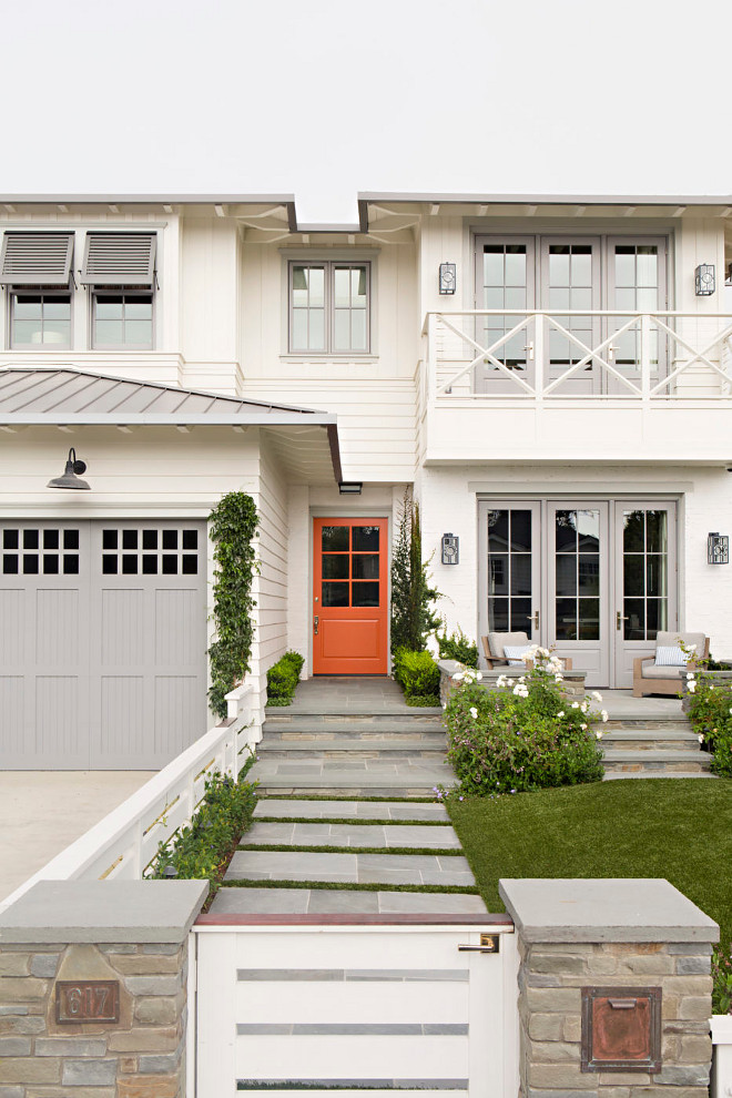 Orange Front Door. Orange Front Door. Beach house with off white siding, light gray trim and garage door. Front door is painted in an orange color. #orange #frontdoor Matt Morris Development