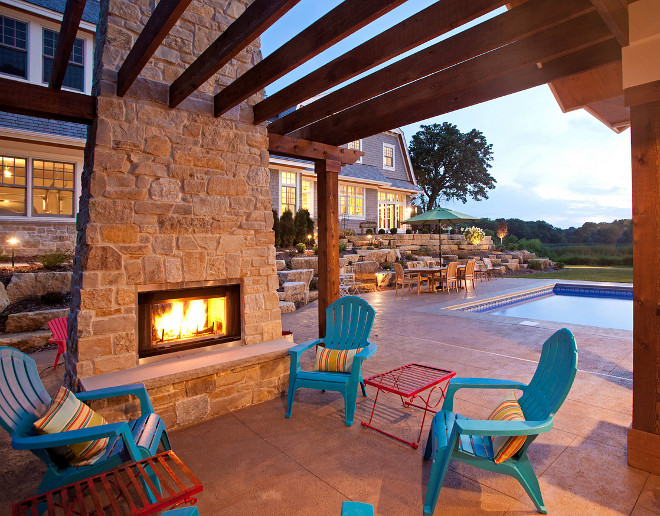 Outdoor fireplace and pergola. Outdoor patio features stone fireplace and pergola. #Pergola #outdoorfireplace #stonefireplace outdoor-fireplace-and-pergola Hendel Homes