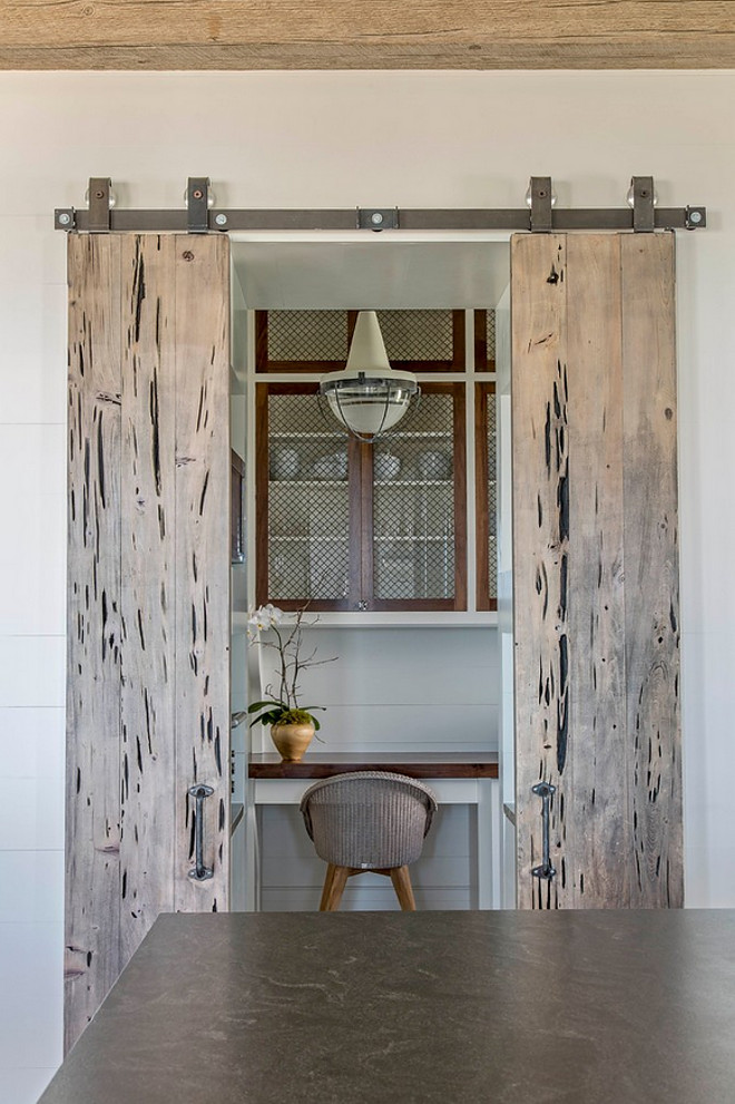 Pecky Cypress Barn Door. Barn Door. The kitchen features a Pecky Cypress Barn Door leading to butler's pantry. pecky-cypress-barn-door #PeckyCypress #BarnDoor #kitchen #KitchenBarnDoor #PeckyCypressBarnDoor Herlong & Associates Architects + Interiors