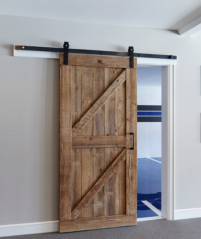 Rustic Barn Door. The custom barn door is made of reclaimed white oak. Rustic Sliding Barn Door. Reclaimed wood Rustic Sliding Barn Door. Rustic Sliding Barn Door #RusticSlidingBarnDoor #RusticBarnDoor #SlidingBarnDoor #Reclaimedwoodbarndoor #barndoor #slidingdoor #barndoorhardware #diy rustic-barn-door Hendel Homes