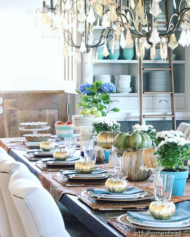 Fall tablescape. I gold leafed my little white pumpkins. The table throws are from Pottery Barn.. and of course, a little blue is always a good idea. autumn-tablescape #fall #falltableideas #centerpiece Home Bunch's Beautiful Homes of Instagram @artfulhomestead