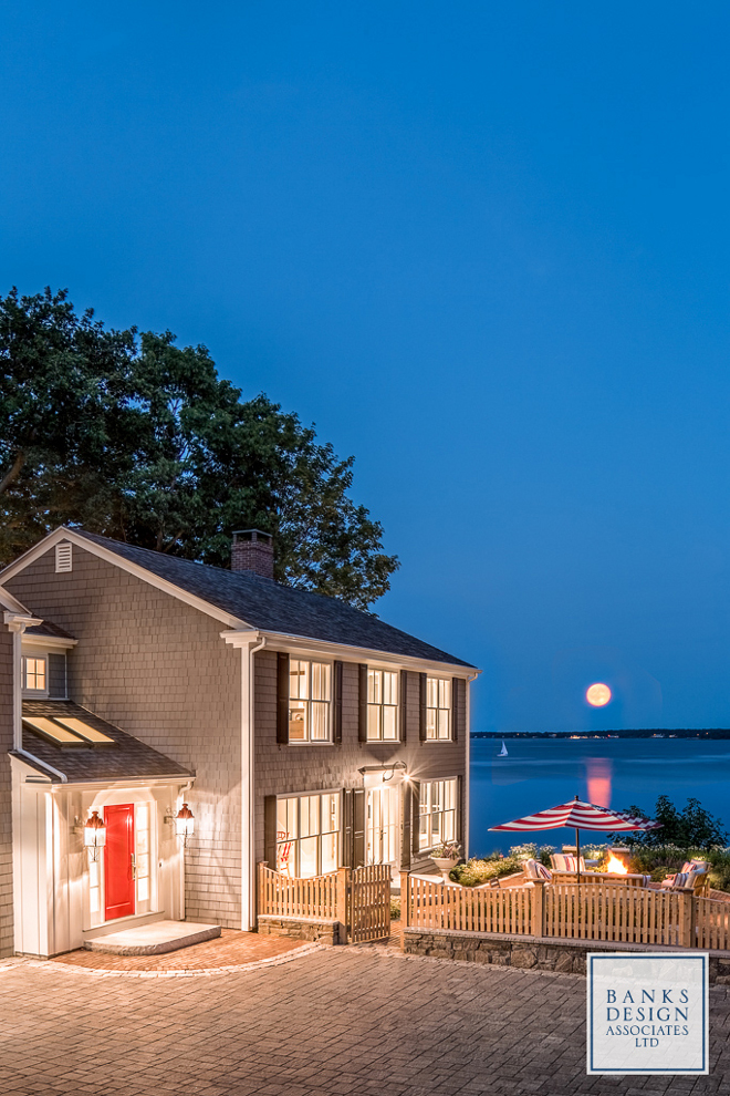 Beach house. Shingle beach house with red door. Red door paint color specified on the blog Home Bunch. #shinglebeachhouse #shinglehouse #reddoor #redfrontdoor #paintcolor Banks Design Associates, LTD & Simply Home