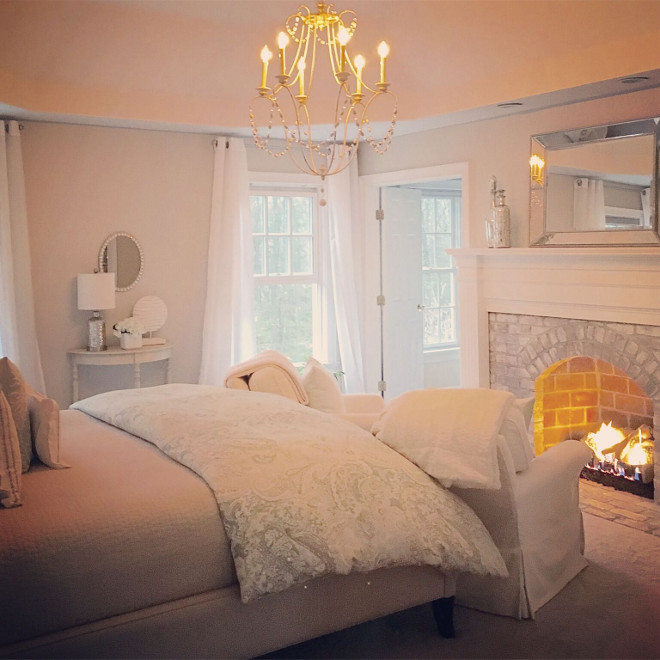 Bedroom whitewashed brick fireplace. The fireplace had never been used, so it was in perfect shape when we bought the house. It keeps us toasty and warm on chilly winter nights. We whitewashed the fireplace brick (half water, half paint) to give it a softer look. #bedroom #fireplace #whitewashedbrick #bedroomfireplace Home Bunch's Beautiful Homes of Instagram peonypartydesigns 