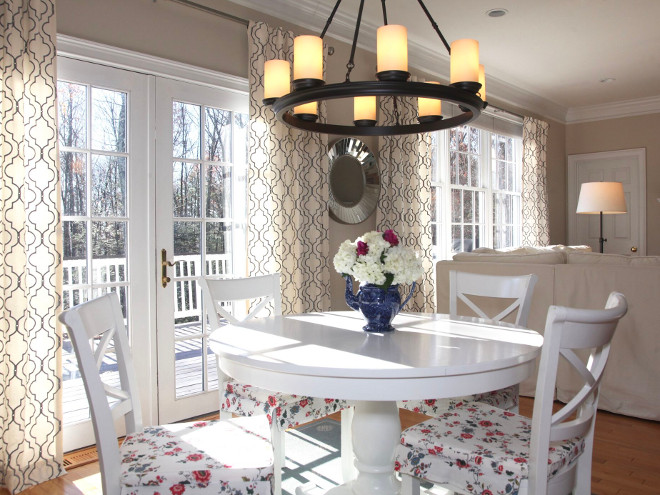 Breakfast room furniture and lighting. Table & Chairs: Avalon 45” White Extension Dining Table ($499) and Vintner White Wood Dining Chairs ($149), Crate & Barrel Chair Cushions: IKEA. Hurricane Candles & Chandelier: Veranda Round Chandelier, Pottery Barn ($399). Home Bunch's Beautiful Homes of Instagram peonypartydesigns 