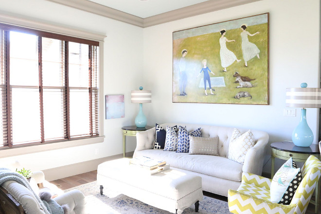 Kitchen Sitting Room. The kitchen opens to this bright and colorful sitting room. Painting by Utah artist Brian Kershisnik titled 'Dancing to Places.' Home Bunch's Beautiful Homes of Instagram @artfulhomestead